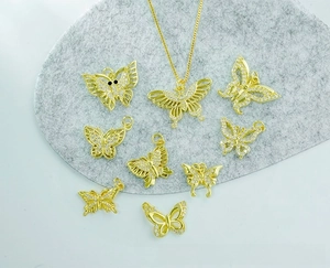 Detail of 18K gold plated copper butterfly pendants with micro-pave cubic zirconia