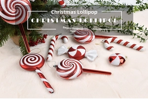 Macro detail of red and white Christmas candy cane ornaments with glitter on plush background