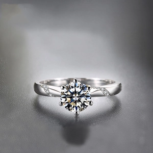 Classic platinum plated ring with round brilliant cut moissanite and micro-pave diamonds