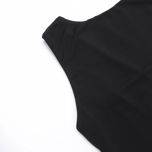 Close-up of black mesh fabric detail and texture on backless sleeveless dress