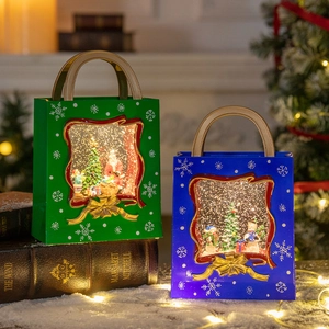 Christmas lantern music box with Santa and Snowman in a warm festive decorative setting