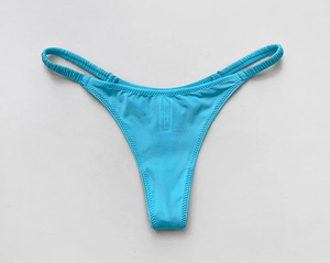 Macro detail of the bright blue ice silk bikini thong with pleated elastic straps