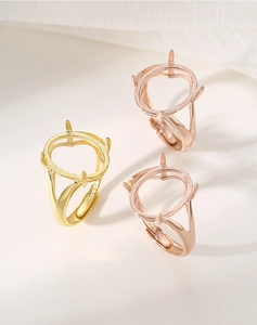 Macro view of S925 silver ring settings with four-prong mounts in gold and rose gold
