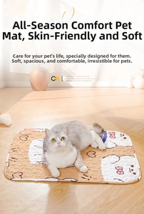 Short-haired cat resting on a soft quilted beige bear pattern pet sleeping mat