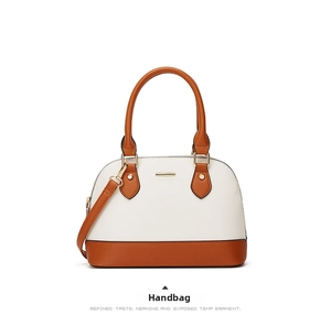 Close-up of Saffiano leather texture on a beige and caramel two-tone designer tote bag