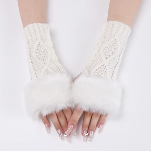 Detail of white cable knit fingerless gloves with soft faux fur cuffs and ribbed texture