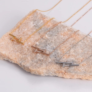 Minimalist geometric interlocking pendant necklaces in gold, rose gold, and silver finishes