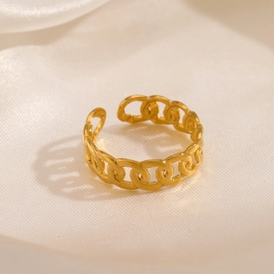 Adjustable gold plated stainless steel chain ring displayed on elegant silk fabric