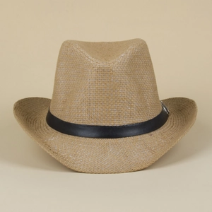 Detail of straw cowboy hat featuring tight weave texture and black band with silver buckle