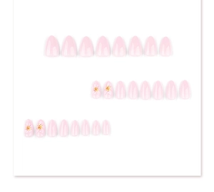 Detail of short almond press-on nails with 3D white flowers and pink jelly finish