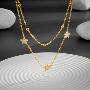Double-layered gold stainless steel necklace with white star-shaped shell pendants