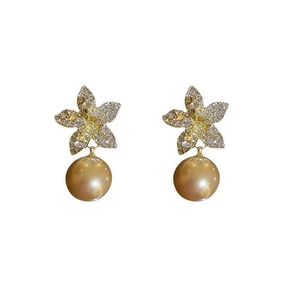 Elegant gold flower earrings with sparkling crystals and a large hanging pearl