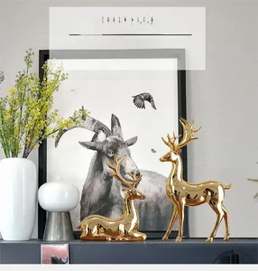 Detail of luxury golden elk statues set in a modern home living room decor setting