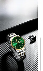 Detail of green sunray dial watch with gold Roman numerals and dual calendar display