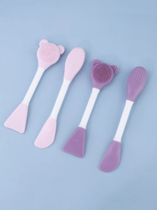 Macro detail of dual-ended silicone face brushes with soft massage bristles and scoops