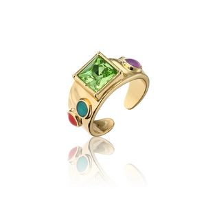Detail view of gold bohemian ring featuring large green zircon and colorful gemstones
