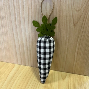 Detail of fabric carrot banner with black and white plaid pattern and green felt leaves