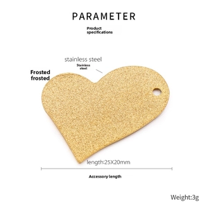 Macro detail of a 25x20mm gold frosted stainless steel heart pendant for necklaces