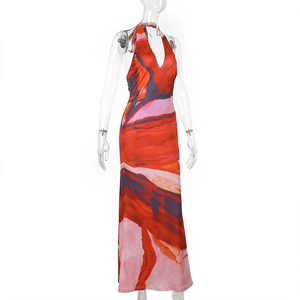 Detail of the deep V-neckline and abstract watercolor print on the halter maxi dress