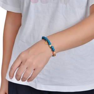 Blue natural stone beaded bracelet featuring golden Pisces zodiac and star charm on wrist