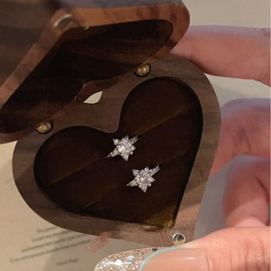 Minimalist silver star earrings with cubic zirconia in a heart-shaped wooden gift box