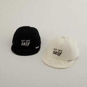 Detailed close-up of SASY letter embroidery on soft cotton baby caps in black and beige