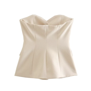 Detailed close-up of the beige strapless slim-fit top with high-quality woven fabric texture