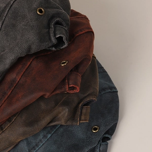 Detail of vintage distressed leather textures with metal eyelets in multiple colors