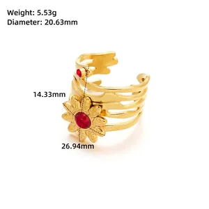 Macro shot of gold sunflower ring with red gemstone and detailed size measurements