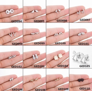 Minimalist silver animal ear studs set featuring heart bird and paw print designs
