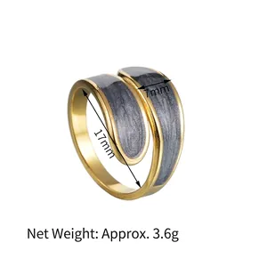 Detail of gold-plated open ring with marble texture, 7mm width and 17mm inner diameter