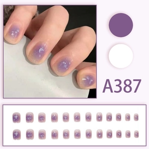 Short purple gradient press-on nails with white star and moon patterns with glitter
