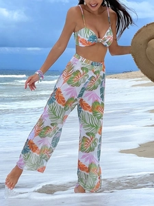 Detail of tropical palm leaf print bikini with sheer mesh wide-leg pants beach set