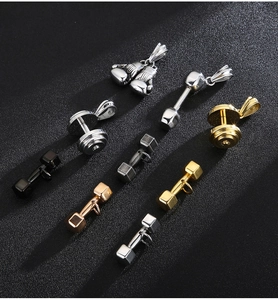 Close-up of dumbbell and boxing glove pendants in silver, gold, black and rose gold finishes