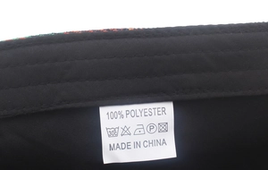 Detail shot of the internal polyester fabric and washing label on the newsboy cap