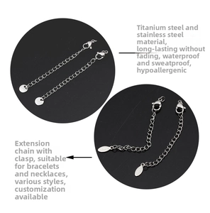 Close-up of stainless steel extension chain with lobster clasp and metal tag