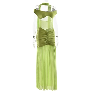 Close-up of grass green ruched mesh fabric and side slit detail on the long dress