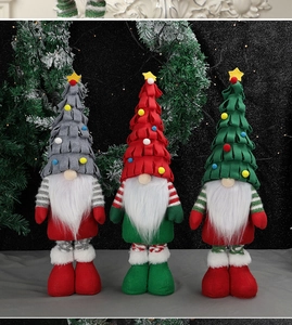 Three colorful Christmas gnomes with long white beards and festive hats on dark background