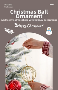 Close-up of gold wire hollow ball and red patterned ornament on a snowy Christmas tree
