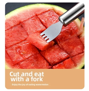 Dual-purpose stainless steel fruit fork picking up a fresh square watermelon slice