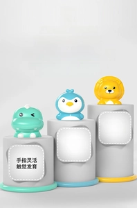 Macro shot of developmental pop-up toys featuring dinosaur, penguin and lion animals