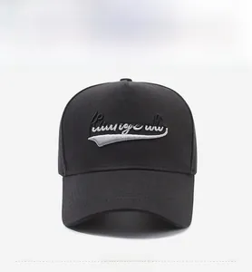 Close-up of black 5-panel cotton baseball cap with 3D letter embroidery and curved brim