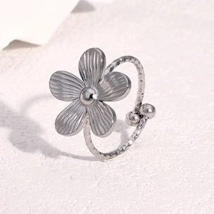 Minimalist silver flower open ring in stainless steel with hammered texture for women