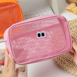 Pink mesh makeup bag with cartoon eyes for travel and large capacity storage