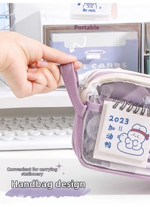 Detail of purple large-capacity pencil case featuring transparent window and side handle