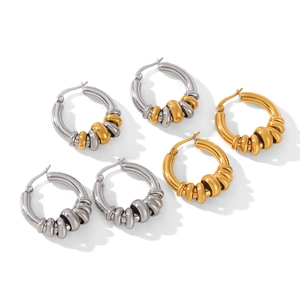 Three pairs of thick bicolor stainless steel hoop earrings in gold and silver finishes