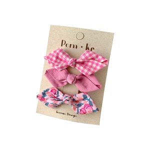 Set of 3 floral and checkered bow hair clips for girls in pink fabric textures