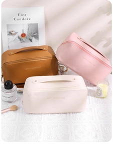 Three multi-color portable PU leather cosmetic bags with wide handles and zipper closure