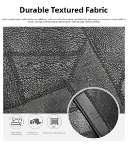 Detail of black lychee-grain leather texture with reinforced stitching on tote bag