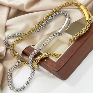 6mm titanium steel snake chain necklaces in gold and silver set on silk fabric